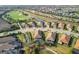 Aerial view of a residential area showcases a well manicured neighborhood near a golf course at 4543 Terrazza Ct, Lakewood Ranch, FL 34211