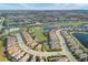 Panoramic aerial view of the community featuring meticulously landscaped homes, lush golf course, and shimmering lakes at 4543 Terrazza Ct, Lakewood Ranch, FL 34211