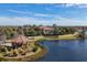 Stunning community aerial view of lake, gazebo, and clubhouse surrounded by lush landscaping at 4543 Terrazza Ct, Lakewood Ranch, FL 34211