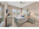 Comfortable bedroom with bright windows, plantation shutters and neutral color scheme at 4543 Terrazza Ct, Lakewood Ranch, FL 34211