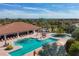 Aerial view of community pool, seating areas and palm trees create a resort style experience at 4543 Terrazza Ct, Lakewood Ranch, FL 34211