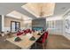 A beautifully designed dining room area with brick tray ceilings and a modern fireplace and wine display at 4543 Terrazza Ct, Lakewood Ranch, FL 34211