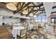 Bright and airy dining room featuring elegant tables, chairs, and large windows with scenic views at 4543 Terrazza Ct, Lakewood Ranch, FL 34211