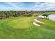 Beautiful aerial view of a well-maintained golf course, featuring smooth greens and a tranquil pond at 4543 Terrazza Ct, Lakewood Ranch, FL 34211