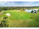 Gorgeous green golf course aerial with sand traps, green grass and a pristine pond at 4543 Terrazza Ct, Lakewood Ranch, FL 34211