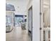 Hallway view to living room, dining area, and a half bathroom with pedestal sink at 4543 Terrazza Ct, Lakewood Ranch, FL 34211