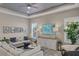 Cozy living room with neutral colors, and ample natural light, creating a serene and inviting atmosphere at 4543 Terrazza Ct, Lakewood Ranch, FL 34211