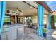 View of the patio featuring tile flooring, a modern bar and an indoor/outdoor flow at 4543 Terrazza Ct, Lakewood Ranch, FL 34211