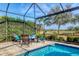 View of the refreshing screened in pool area with comfortable seating at 4543 Terrazza Ct, Lakewood Ranch, FL 34211