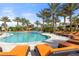 Community pool surrounded by lounge chairs and palm trees at 4543 Terrazza Ct, Lakewood Ranch, FL 34211