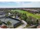 Aerial view of the tennis courts and surrounding golf course create an attractive, active community at 4543 Terrazza Ct, Lakewood Ranch, FL 34211