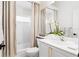 Well-lit bathroom with a shower-tub combination, white vanity, and stylish fixtures at 5063 Timber Chase Way, Sarasota, FL 34238