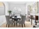 Bright dining room features a dark wood table and modern chairs under an arched window at 5063 Timber Chase Way, Sarasota, FL 34238