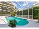 Bright and airy pool with screened enclosure and well maintained landscaped backyard at 5063 Timber Chase Way, Sarasota, FL 34238