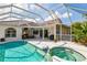 Inviting pool and spa with screened enclosure, complemented by a spacious outdoor area at 5063 Timber Chase Way, Sarasota, FL 34238