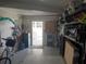 Bright garage featuring shelving, storage, and access to the backyard at 5075 Tri Par Dr, Sarasota, FL 34234