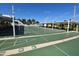 Outdoor shuffleboard courts with benches, poles and shade, providing an enjoyable recreational space at 5075 Tri Par Dr, Sarasota, FL 34234