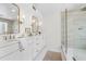 Luxurious bathroom featuring double sinks, a glass shower, and elegant fixtures at 55 Tidy Island Blvd, Bradenton, FL 34210