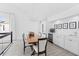 Bright dining room with a chandelier, wet bar, wine cooler and large windows at 55 Tidy Island Blvd, Bradenton, FL 34210