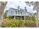 Charming coastal home with multiple windows and partial view of the screened lanai at 55 Tidy Island Blvd, Bradenton, FL 34210