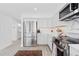 Well-lit modern kitchen with stainless steel appliances, white cabinetry and marble countertops at 55 Tidy Island Blvd, Bradenton, FL 34210