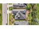 Overhead view of a house with a neatly designed roof, surrounded by green lawns and trees at 5718 Westhaven Cv, Bradenton, FL 34203