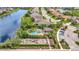 Community aerial view featuring pool, playground, and nearby lake views enhancing the neighborhood appeal at 5718 Westhaven Cv, Bradenton, FL 34203