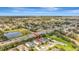 The aerial view of a house in a neighborhood showcases its proximity to community parks and well-connected roadways at 5718 Westhaven Cv, Bradenton, FL 34203