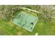 Aerial shot of a basketball court, surrounded by trees, perfect for recreational activities at 5718 Westhaven Cv, Bradenton, FL 34203