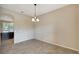 Cozy dining room featuring an elegant chandelier and easy access to the kitchen, perfect for Gathering meals at 5718 Westhaven Cv, Bradenton, FL 34203