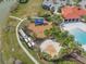 A beautiful aerial view of the community park, splash pad, and playground at 5821 Hevena Ct, Palmetto, FL 34221