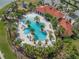 Aerial view of the community pool, playground and clubhouse surrounded by lush landscaping and inviting amenities at 5821 Hevena Ct, Palmetto, FL 34221