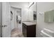 Bathroom featuring single vanity sink, toilet, and doorway leading out of the room at 5821 Hevena Ct, Palmetto, FL 34221