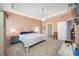 Tranquil primary bedroom featuring a tray ceiling, chandelier, and neutral color palette at 5821 Hevena Ct, Palmetto, FL 34221