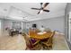 Bright dining area with a view into the living room and outdoor living space at 5821 Hevena Ct, Palmetto, FL 34221