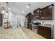 Granite countertops and stainless appliances accent this well-lit modern kitchen at 5821 Hevena Ct, Palmetto, FL 34221