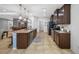 Spacious kitchen featuring a large island, stainless steel appliances, and dark wood cabinetry at 5821 Hevena Ct, Palmetto, FL 34221