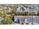 This aerial shot showcases a well-maintained apartment complex with ample parking and lush landscaping at 5855 Palm Ln # B21, Bradenton, FL 34207