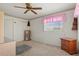 Cozy bedroom featuring classic decor, neutral carpeting, and a sliding door closet at 5855 Palm Ln # B21, Bradenton, FL 34207