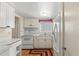 Functional kitchen featuring white cabinets, linoleum flooring, and essential appliances at 5855 Palm Ln # B21, Bradenton, FL 34207