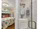 Contemporary bathroom showing corner sink, vanity, and glass enclosed shower at 6016 Hibiscus Dr, Bradenton, FL 34207