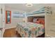 bedroom features a bunk bed with stylish bedding and ample natural light at 6016 Hibiscus Dr, Bradenton, FL 34207