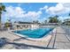 Community pool featuring a spacious pool deck, lounge chairs, and clubhouse at 6016 Hibiscus Dr, Bradenton, FL 34207