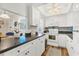 Well-lit kitchen with modern appliances and black countertops at 6016 Hibiscus Dr, Bradenton, FL 34207