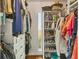 Functional walk-in closet with ample storage, shelving, and an organization system at 6016 Hibiscus Dr, Bradenton, FL 34207