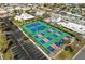 Aerial view of community pickleball courts close to shops, parking and other amenities at 6500 Sunset Way # 311, St Pete Beach, FL 33706