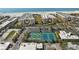 Aerial view of the condo community and tennis courts, offering a beautiful beachside living experience at 6500 Sunset Way # 311, St Pete Beach, FL 33706