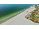 Breathtaking aerial view of a pristine sandy beach with clear turquoise water at 6500 Sunset Way # 311, St Pete Beach, FL 33706