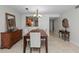 This dining room has a wooden table, six chairs, and a vintage hutch at 6500 Sunset Way # 311, St Pete Beach, FL 33706