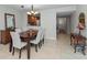 Stylish dining room with modern furniture, views into kitchen, and neutral decor at 6500 Sunset Way # 311, St Pete Beach, FL 33706